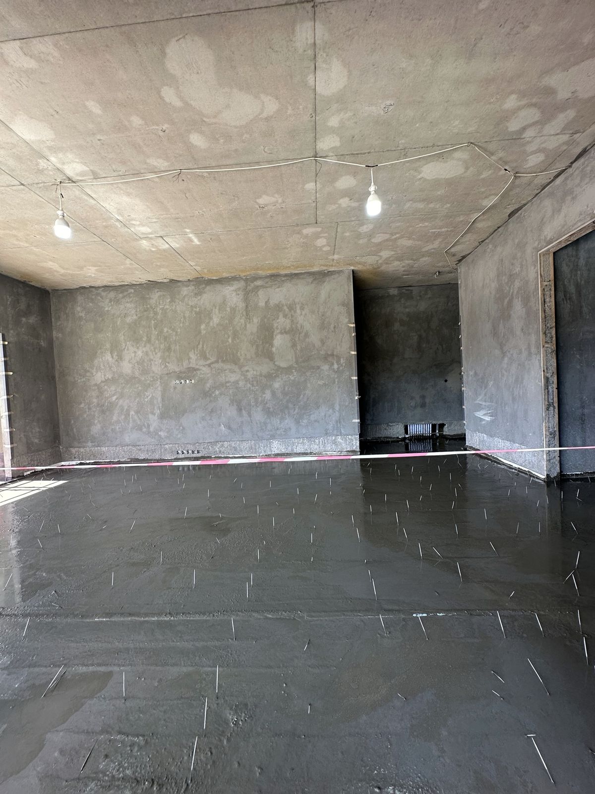 Screed poured over the pipes